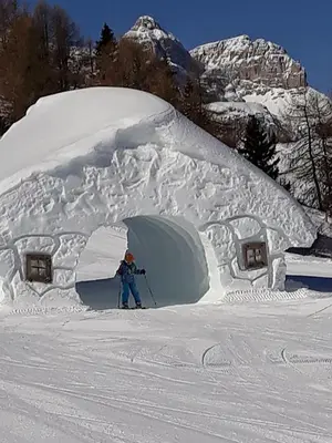 a person is standing inside of a snow igloo at Natur Luch Sossach in La Villa
