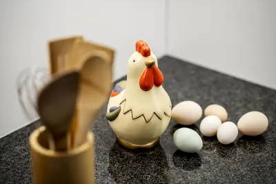 a figurine of a chicken and eggs on a counter at Natur Luch Sossach in La Villa
