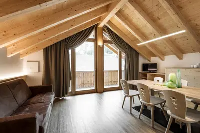 a living room with a couch and a table at Natur Luch Sossach in La Villa
