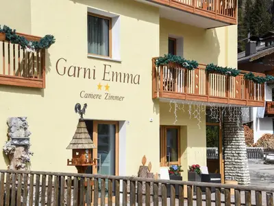 a building with a sign that reads grand emma cancer clinic at Garní Emma in Arabba