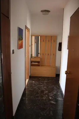 an empty hallway with a door and a room at Guesthouse48 in Bolzano