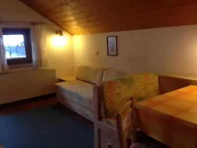 a living room with a couch and a bed at Schuster Emma in Valdaora