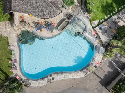 an overhead view of a swimming pool at a resort at Paloria Apartments & Sport in Lagundo