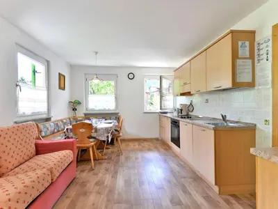 a living room with a couch and a table at Apartment Cecilia-2 by Interhome in Campitello