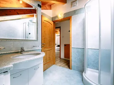 a bathroom with a shower and a toilet and a sink at Apartment Cecilia-3 by Interhome in Campitello