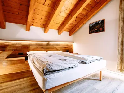 a living room with a table and a couch at Apartment Cecilia-3 by Interhome in Campitello