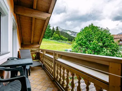 a bed in a room with wooden ceilings at Apartment Cecilia-3 by Interhome in Campitello