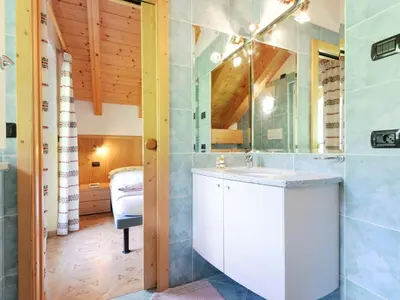 a bathroom with a sink and a mirror at Apartment Cecilia-4 by Interhome in Campitello