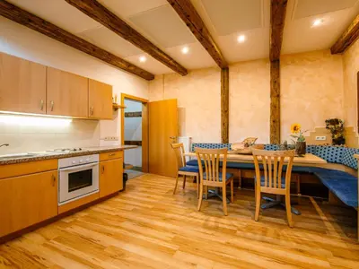 a kitchen and dining room with a table and chairs at Apartment Hocheppan by Interhome in Andrian