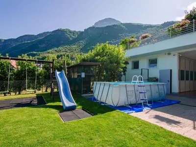 a backyard with a slide and a playground at Apartment Hocheppan by Interhome in Andrian