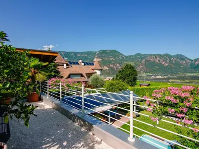 a white fence with flowers in a yard at Apartment Hocheppan by Interhome in Andrian