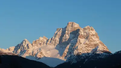 a tall mountain with snow on it at Cesa Fossal in Colle Santa Lucia