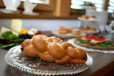 a plate of food on a table with pastries at Untermairhof B&B Christine in Lagundo