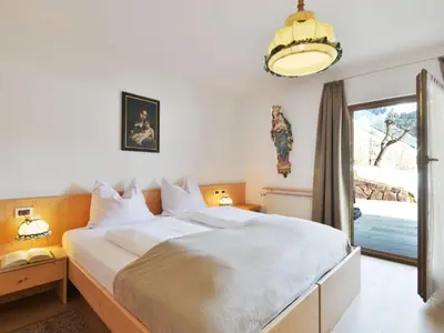 a living room with a table with a bowl of fruit at Apartment Tirol-2 by Interhome in Ortisei
