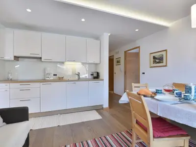 a living room with a couch and a table at Apartment Tirol-2 by Interhome in Ortisei