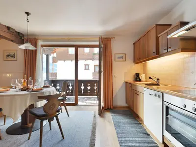 a bedroom with a bed and a wooden ceiling at Apartment Tirol-3 by Interhome in Ortisei