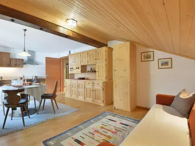 a kitchen with a table and chairs in a room at Apartment Tirol-3 by Interhome in Ortisei