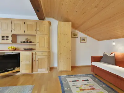 a dining room with a table and a kitchen at Apartment Tirol-3 by Interhome in Ortisei