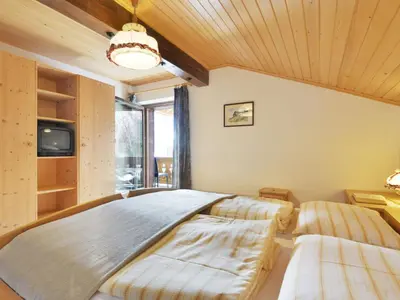 a living room with a couch and a kitchen at Apartment Tirol-3 by Interhome in Ortisei
