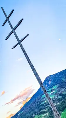a pair of crosses on top of a mountain at Tschott Hof in Villandro