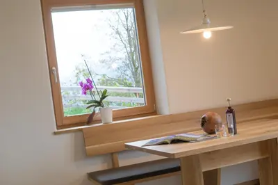 a window in a room with a wooden table at Tschott Hof in Villandro