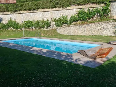 a house on a hill with a green yard at Apartment Classic 303 by Interhome in Villandro