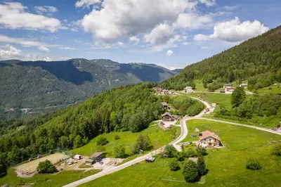 a winding road through a valley in the mountains at Hotel Tirol- Natural Idyll in Montesover
