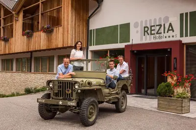 a group of people riding in a jeep at Hotel Rezia in La Villa