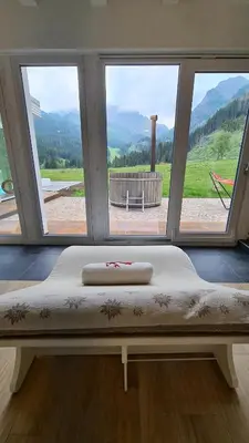 a large window with a mattress in a room at Hotel Vienna in San Martino di Castrozza