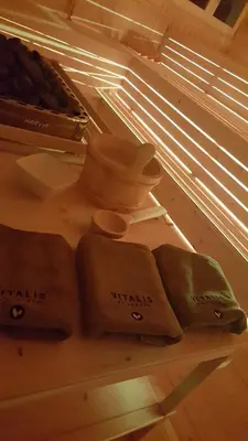 a shelf in a refrigerator with utensils on it at Hotel Vienna in San Martino di Castrozza
