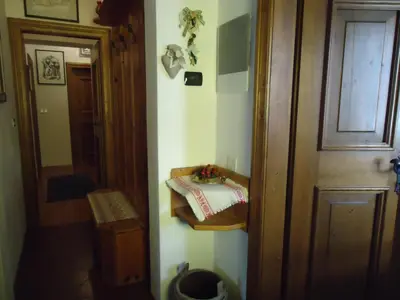 a room with a door and a room with a table at Sweet Home in Cortina dʼAmpezzo