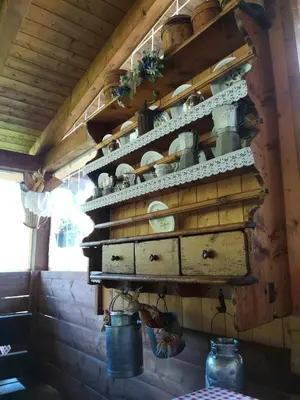 a shelf in a kitchen with pots and pans at Agritur le Vale in Fiera di Primiero