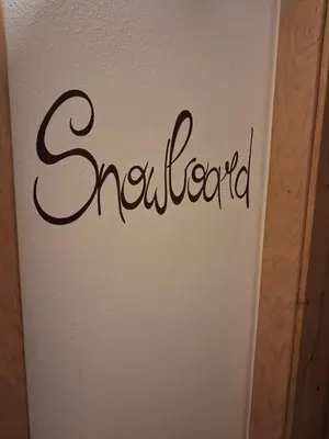 a sign with the word accident written on a wall at Majon de la nona in Pozza di Fassa