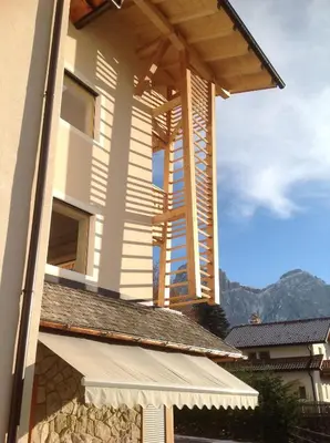 a house with awning on the side of it at Villa Tannenheim in Castelrotto