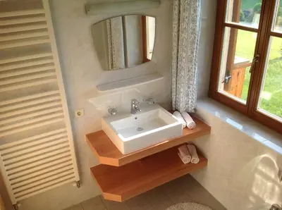 a bathroom with a sink and a mirror at Villa Tannenheim in Castelrotto