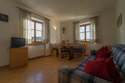 a living room with a couch and a table at Villa Tannenheim in Castelrotto