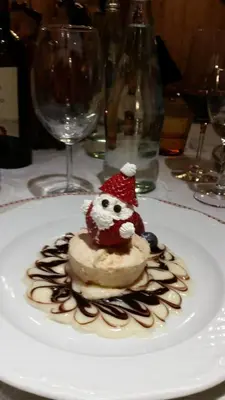 a dessert with a santa hat on a white plate at Hotel El Mondin in Fiera di Primiero