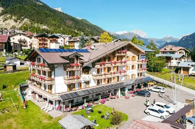 an aerial view of a hotel in the mountains at Berg Hotel Latemar Spitze in Vigo di Fassa