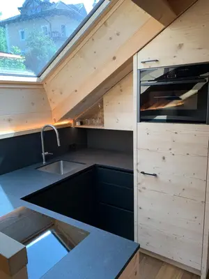 a kitchen in a tiny house with a roof at Villa sulla passeggiata in Ortisei