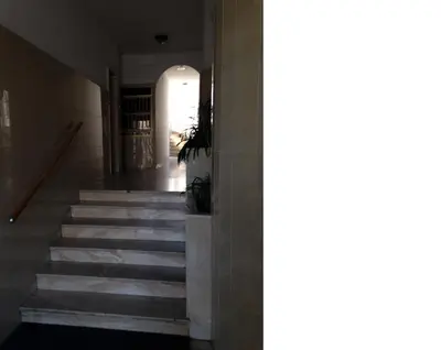a stairway in a building with a hallway at Apartment G.Verdi in Bolzano
