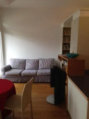 a living room with a couch and a table at Apartment G.Verdi in Bolzano