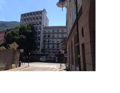 an empty street in front of a building at Apartment G.Verdi in Bolzano