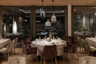 a kitchen with a sign that reads wellness laagna at Hotel La Fradora - Dolomites Hotel in San Cassiano