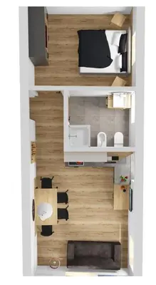 a kitchen and dining room with a wooden table at Active Hotel Sonne in Gais