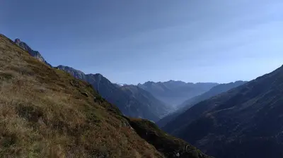 a view of a valley in the mountains at Hotel Schuster in Colle Isarco