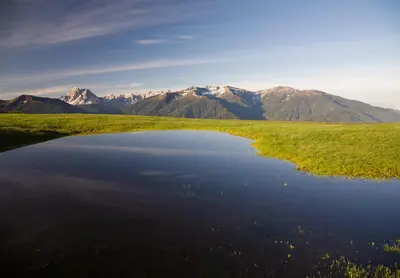 a body of water with mountains in the background at Plonerhof - Ferienhaus Maria in Rodengo