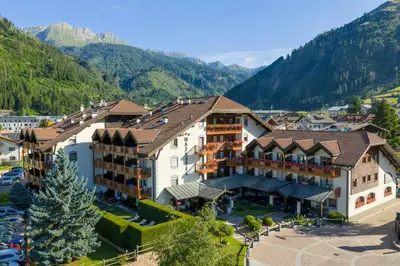 an aerial view of a hotel in the mountains at Aparthotel Majestic in Predazzo