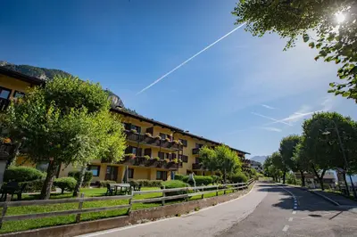 an empty road in front of a building at Residence Lagorai in Tesero