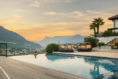 a swimming pool with a view of mountains at Golserhof in Tirolo