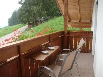 a balcony with chairs and a table and a view at Thalerhof in Perca